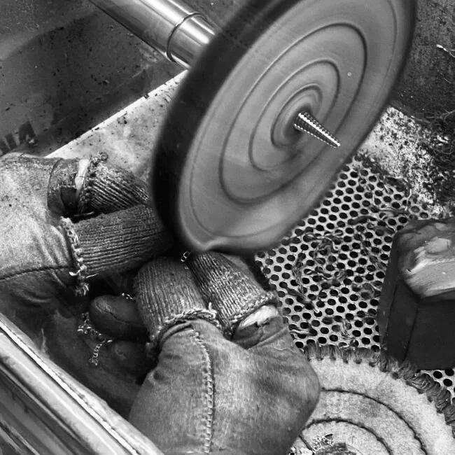 Jeweler completing the final polishing of a ring