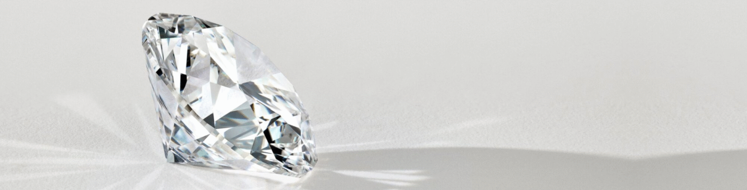 Loose diamonds against a pale jewellery surface